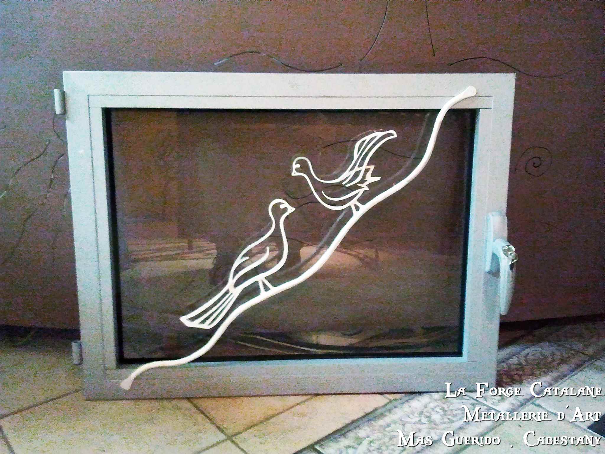 decoration fenetre oiseaux sur branche fer forge catalane cabestany (2).jpg